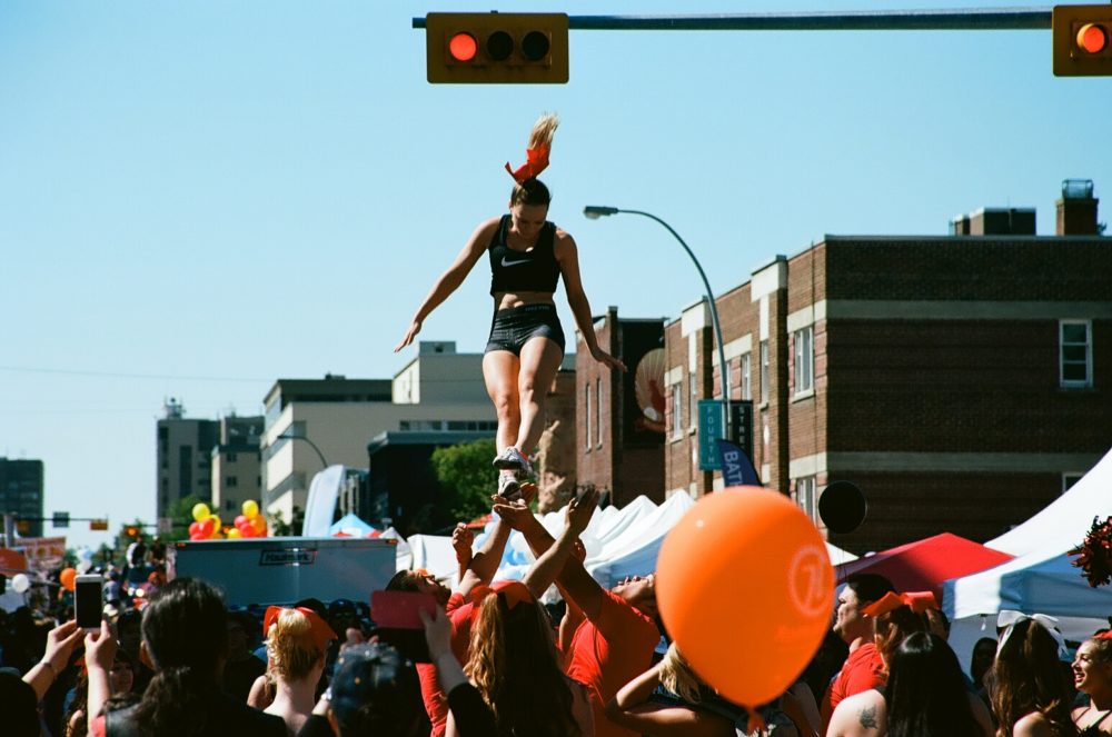 UC Dinos Cheerleaders perform aerials