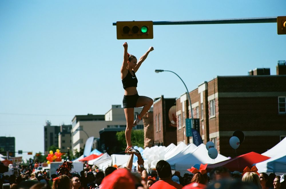 UC Dinos Cheerleaders perform aerials