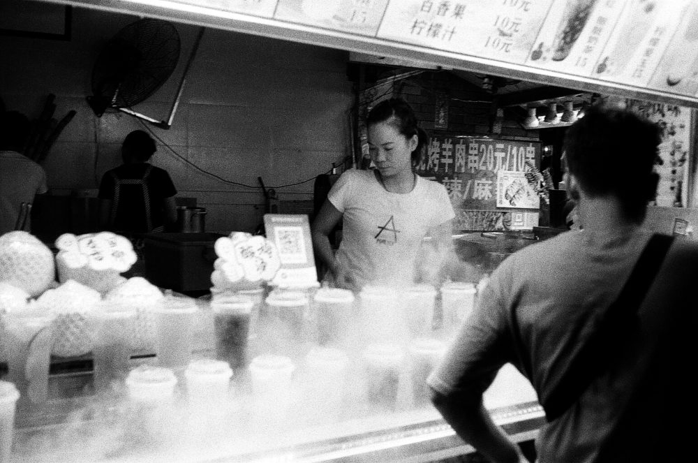 a vendor at Yangshuo's night market in China