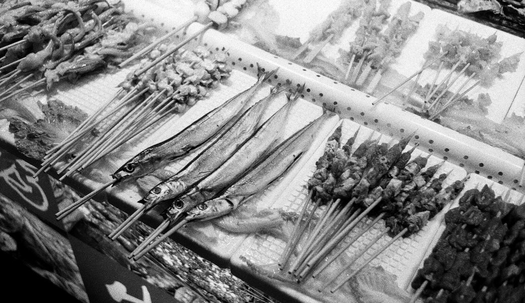 fish on a stick at the Yangshuo night market in China
