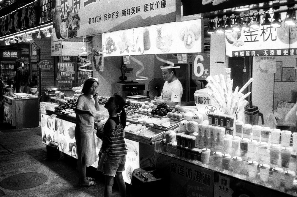 a vendor at the Yangshuo night market in China