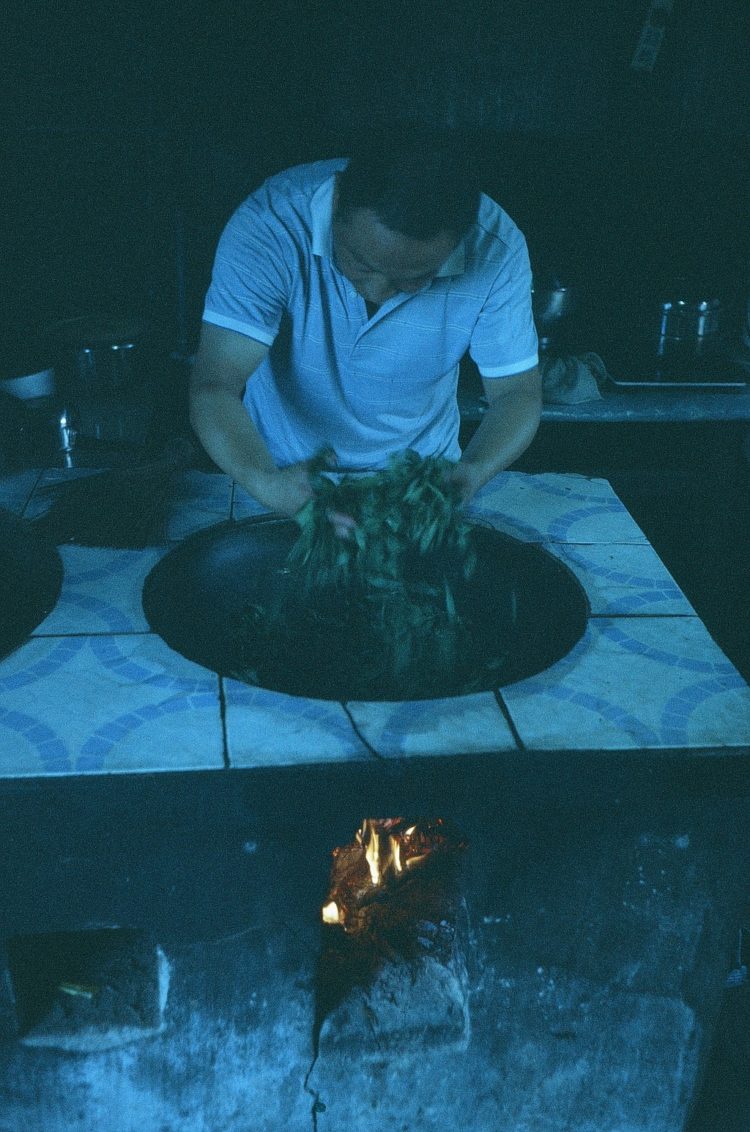 pan-firing tea leaves in Emeishan, China