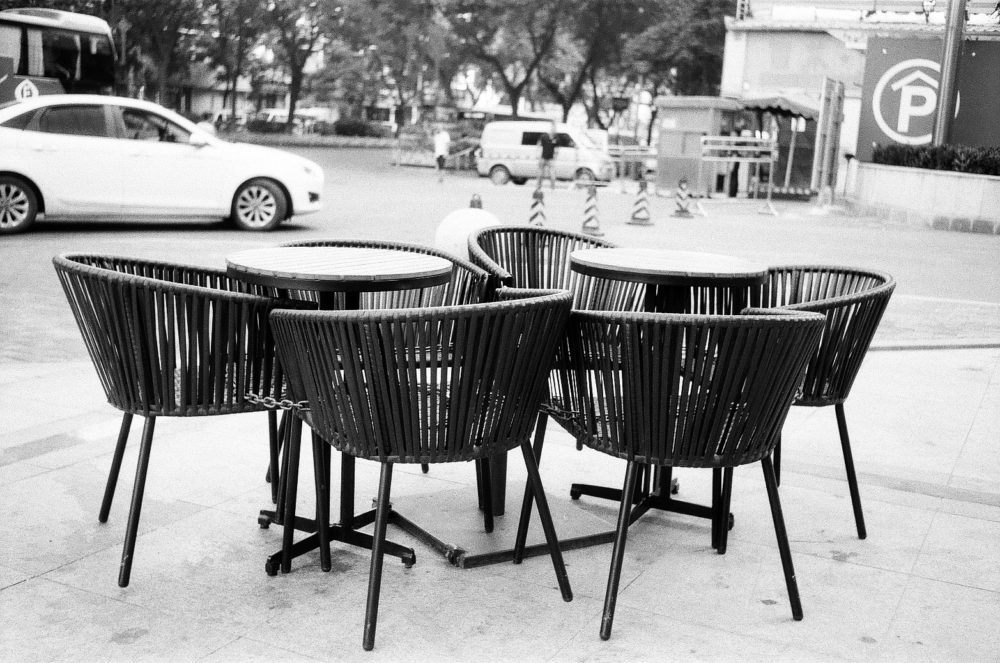 tables and chairs chained together on the street in Xi'an, China