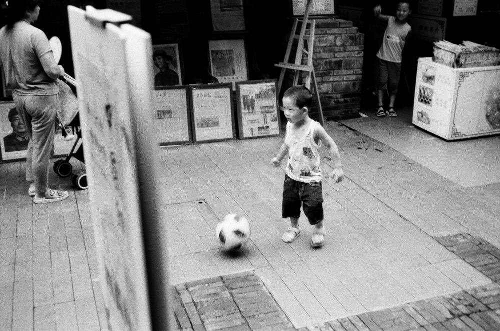 a boy playing soccer in Chengdu