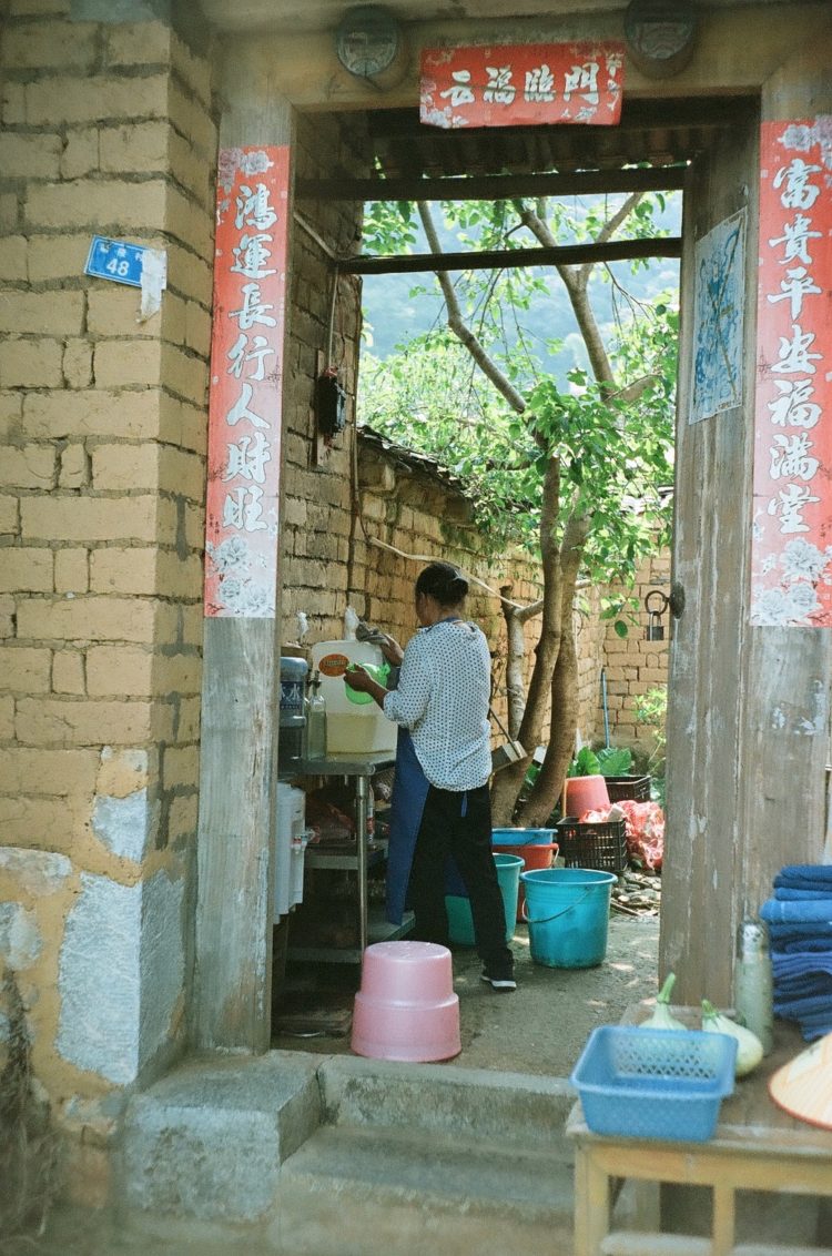 woman in doorway in the Yangshuo countryside