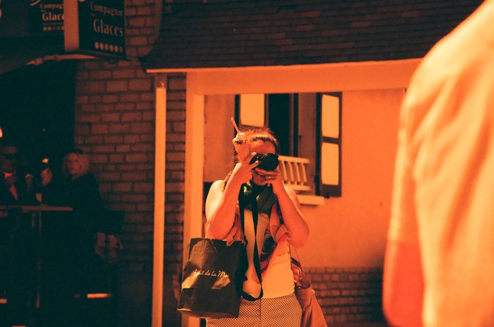 snapping photographs in Arromanches, France