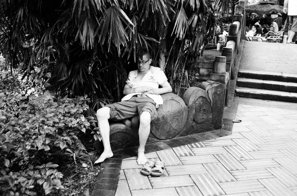 an afternoon nap in People's Park, Chengdu