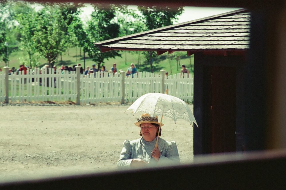 woman with parasol at Heritage Park