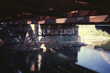 graffiti under a railroad bridge