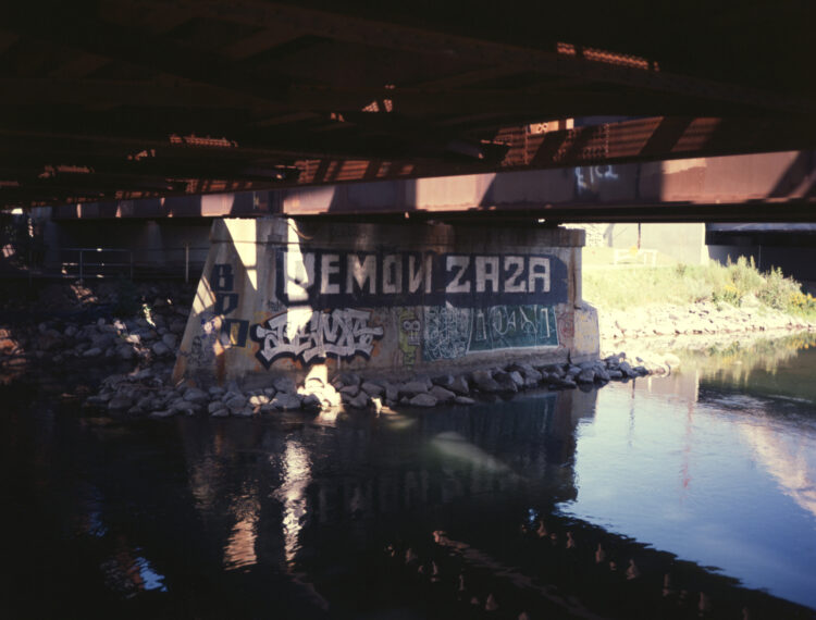 graffiti under a railroad bridge