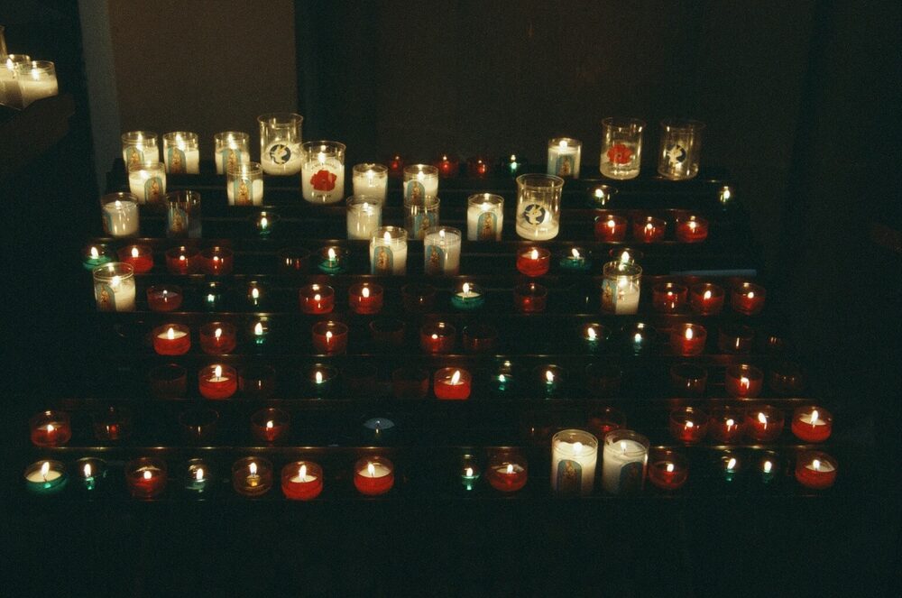 votive candles inside the Bayeux Cathedral