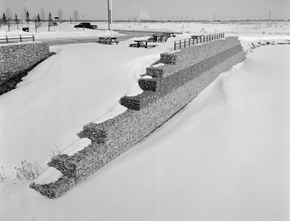 rock wall in the snow at Ralph Klein Park